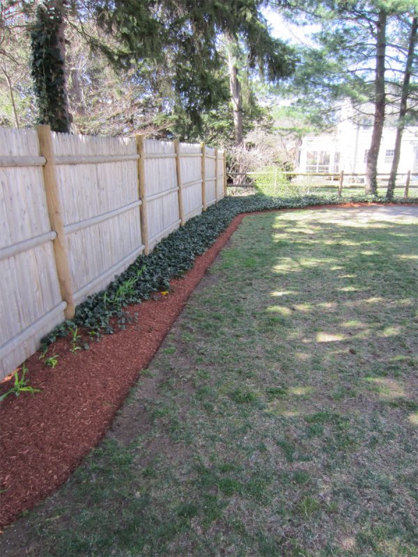 Bed edged straight and mulched with Hemlock
